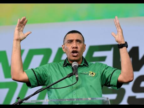 Prime Minister Andrew Holness giving the main address during the Jamaica Labour Party’s 79th annual conference at the National Arena on Sunday.