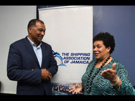 SAJ President William Brown shares a light moment with Vice-President Corah Ann Robertson Sylvester following the body’s annual general meeting last Friday.