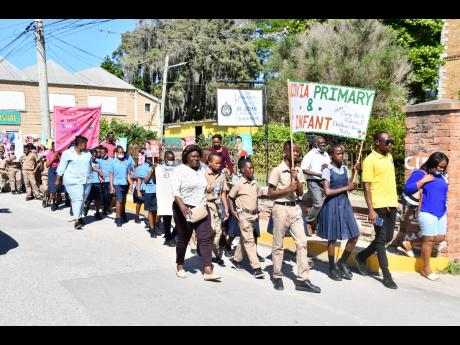 Students from various schools in St Elizabeth participate in a Child Protection and Family Services Agency child abuse sensitisation march in Black River on November 18.