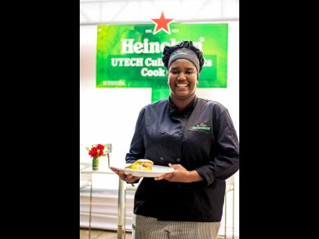 Gleaming with pride – winner Nashjua-Kaye Johnson shows off her winning dish – a seafood pinwheel with Irish and sweet potato mash, sauteed vegetables and topped with a creamy Heineken sauce. 