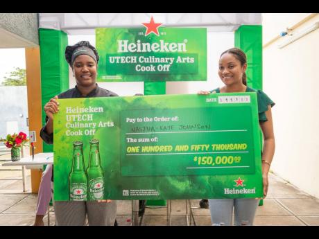 Jodi-Ann Cohen (right), assistant brand manager for Heineken, presented Nashjua-Kaye Johnson with a cheque for $150,000.