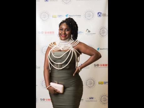  Engineer Shauna-Kaye East Bevan’s pearl-inspired shoulder chain added a dramatic touch.   