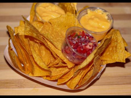 Each order of fried tortilla chips gets two servings of a creamy blend of cheeses and chef Venessa Clarke’s ‘special salsa’. 