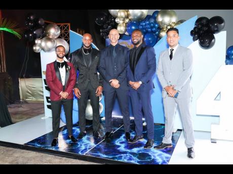 Looking daper in suits of various cuts and colours, birthday boy Asafa Powell (second left), is joined by (from left), Carey Escoffrey, Zachary Harding, Xavier Gordon and Juan Mosquera.