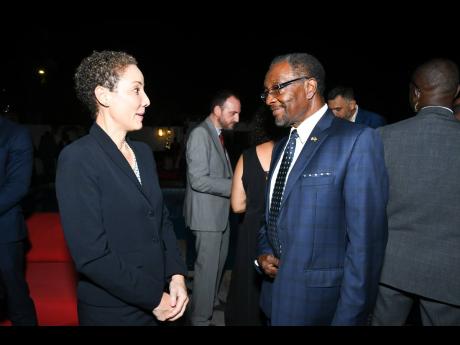 We snapped Minister of Foreign Affairs and Foreign Trade Senator Kamina Johnson Smith having a chat with United States Ambassador to Jamaica, N. Nick Perry.