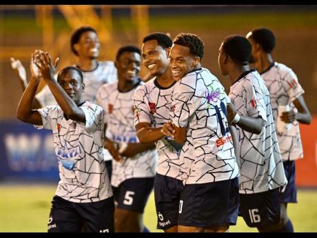 
Jamaica College players celebrate after a penalty shoot-out win over St Andrew Technical High School in the semi-final of the ISSA/Wata Champions Cup inside the National Stadium yesterday.