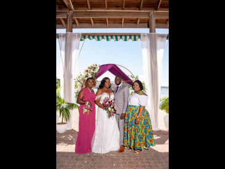 The bride and groom were joined on the momentous occasion by their lovely family members. On the left is the mother of the bride, Myrtle Samuels. At right is right is the big sister of the groom, Marcia Greaves. 
