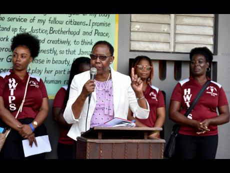 Accompanied by members of the parent-teacher association, Half-Way Tree Primary School Principal Carol O’Connor Clarke addresses the morning devotion on Monday. Behind her are (from left) Tresha Hamilton, Kelly-Ann Fraser (hidden), Amoi Henry and Karen S