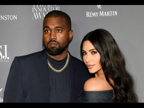 Ye (left),  who legally changed his name from Kanye West, and Kim Kardashian, have reached a settlement in their divorce, averting a trial that had been set for next month.