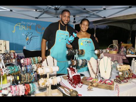 The Original Arm Candy boss Gianna Fakhourie, conceptualiser of the Jamaica Art and Gift Festival, with husband Jonathan Neil, at Murray’s Farm on Sunday. 