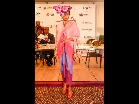 Supreme Ventures Limited Director Eroleen Anderson demonstrates the glamorous approach to the Mouttete Mile Race Day with her fascinator, et al.