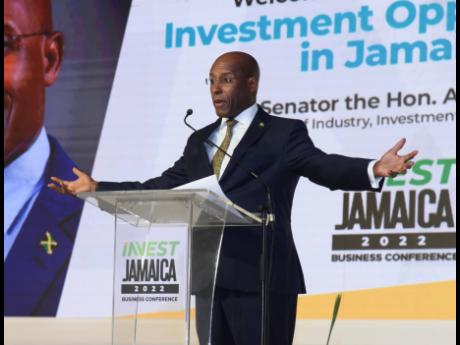 Aubyn Hill, minister of industry, investment and commerce, addresses the audience at the Invest Jamaica 2022 Business Conference on Day One at the Montego Bay Convention Centre on Tuesday.
