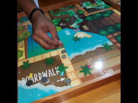Game lovers making a move on the Island Vibes ludo board.