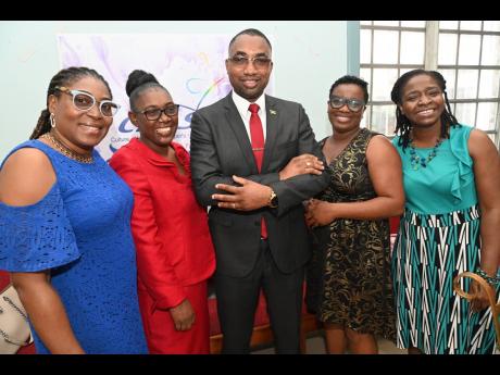 CHASE Fund Chairman Omar Frith poses with guests from the Early Childhood Commission (from left): Simone Ellis-Dixon, director, sector support services; Tracy-Ann Morgan-Smith, director, regulations and monitoring; Nicole Morgan, manager, training and deve