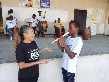 The social worker listens as Aniko Campbell plays the recorder with which he recently passed an ABRSM Level 1 exam, with merit. 