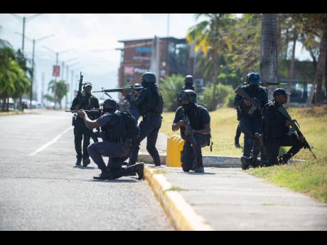 In this April 2021 photo members of the Jamaica Constabulary Force conduct a special ops training exercise at the waterfront in downtown Kingston. 