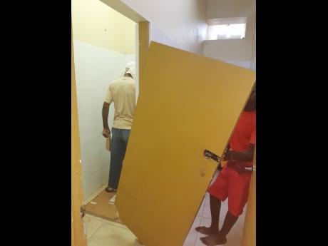 At the Savanna-la-Mar Public General Hospital in Westmoreland, visitors have to be wary of a dangling stall door inside the men’s restroom
