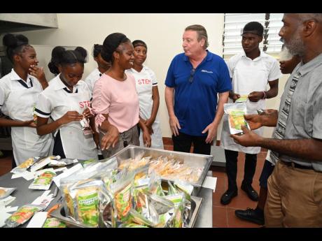 Jean-Philippe Beyer, (third right) managing director, J. Wray & Nephew Limited with Yvette Thompson-Mullings, (left) head of department for Home Economics and Stevie Williams, vice principal- administration agriculture at Sydney Pagon STEM Academy and stud