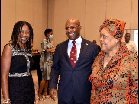 Minister of Industry, Investment and Commerce, Senator Aubyn Hill, shares a moment with Chief Executive Officer of the Jamaica Business Development Corporation (JBDC), Valerie Veira (right), and Manager of Business Advisory Services, JBDC, Melissa Barrett,