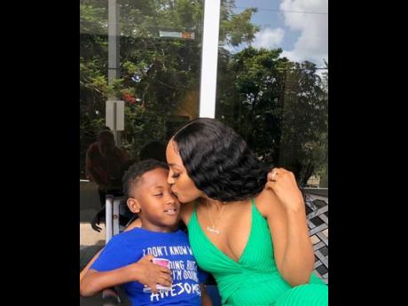  Kimberly gently kisses her son, Khalif.
