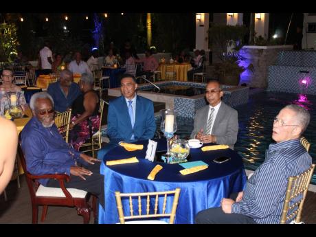 Prime conversation! From left: Former Prime inister P.J. Patterson, Prime Minister Andrew Holness, Deputy Prime Minister Horace Chang, and former Prime Minister Bruce Golding having a round-table talk!