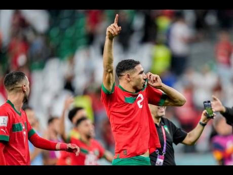 Morocco’s Achraf Hakimi celebrates his team’s victory at the end of the World Cup round of 16 soccer match against Spain at the Education City Stadium in Al Rayyan, Qatar yesterday.