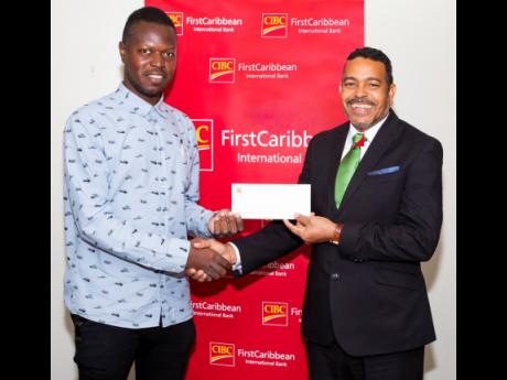 The Portmore Self-help Disability Organisation (PSHDO) recently received support from CIBC FirstCaribbean. Here, Cleon Porter (left), director, PSHDO, receives the bank’s cheque from Managing Director Nigel Holness. The PSHDO has over 30 members and advo