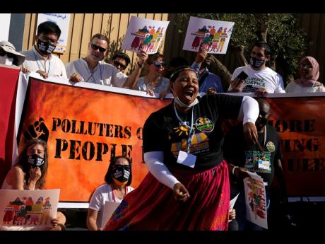 Demonstrators participate in a Kick Big Polluters Out protest at the COP27 UN Climate Summit in Sharm el-Sheikh, Egypt, on November 10. 