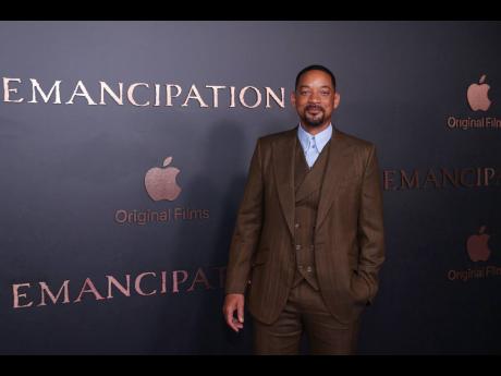 Will Smith poses for photographers upon arrival for the premiere of the film ‘Emancipation’ in London, on Friday.