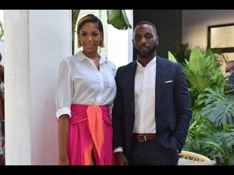 Sporting a new, sleek and short do is Julian Dixon (left), CEO of Sotheby’s International Realty Jamaica, with Archibald Gordon.
