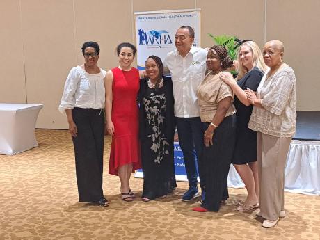 Health and Wellness Minister Dr Christopher Tufton (centre) with the six nurses, who formed the first team brought into Jamaica under the Code Care programme, at a reception at the Hilton Rose Hall Resort in Montego Bay, St James on Tuesday. The nurses are