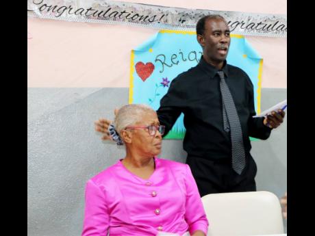 Althea Fuller’s face reflects the confusion as the chairman/moderator Anthony Simpson reveals that what was promoted as an evening to honour parents was actually a surprise tribute to her as outgoing principal of the  Gospel Refuge Tabernacle Basic Schoo