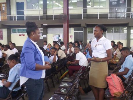 Lakin Nedrick (left), managing director of the ACE Institute in Montego Bay, St James, engages students of the Montego Bay Community College in a discussion on mental health.
