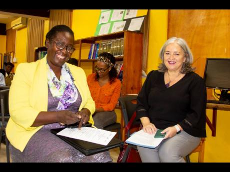 Kennecy Davidson (left), chief education officer (acting), guidance and counselling unit, Ministry of Education and Youth, representing Minister of Education and Youth Fayval Williams and Morana Smodlaka Krajnović, chief of party, Jamaica Local Partner De