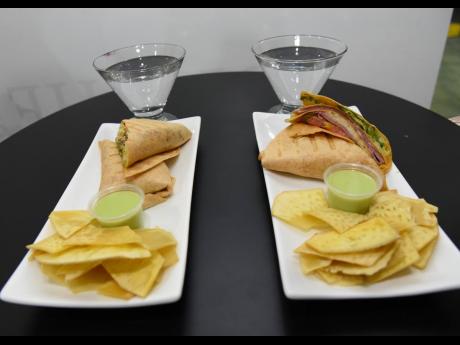 A healthy complement and tasty starter, like a spicy grilled chicken wrap (left) or turkey breast and ham wrap are good choices if you plan to have a sip of spirits. And don’t forget the breadfruit chips as a side.