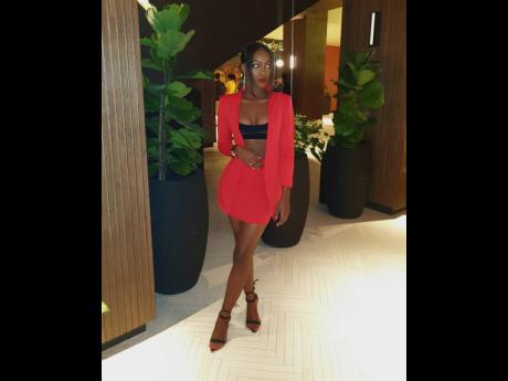 Fashion Designer Lavinea Gayle suits up to step out this holiday in red hot fashion.
