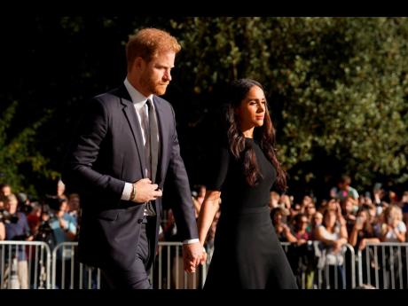 FILE - Meghan, Duchess of Sussex and Prince Harry meet members of the public at Windsor Castle, following the death of Queen Elizabeth II in September in Windsor, England. Prince Harry and his wife, Meghan, vented their grievances against the monarchy in t