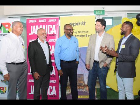 From left: Donnie Dawson, deputy director of tourism, in conversation with Robin Russell, president, Jamaica Hotel and Tourist Association; Donovan White, director of tourism; Chris Daugherty, director of guest experience strategy at Spirit Airlines; and R