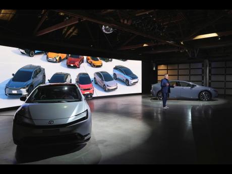 Ian Cartabiano, Vice President of Advance Design for Toyota Motor talks about the 2023 Toyota Prius as some of the company’s concept cars flash on a screen.