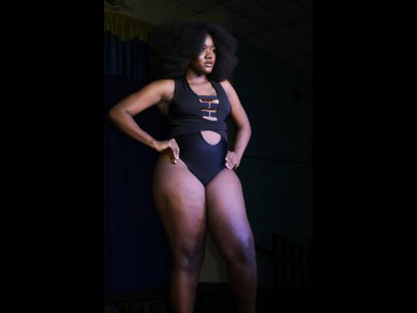 Wasomi Beauty Talent and Modeling Agency embraces women of all shapes and sizes, and here one of their models, stands boldly in swimwear by The Clothing Manipulator. 