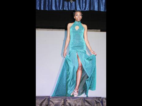 Martha McGregor walks confidently down the runway in this Endlesz Dezigns creation. 