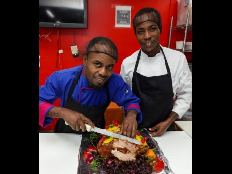 Head Chef at Select Grocers Manor Park, Lishone Ramsden, and Assistant Chef Lovel Lodrick. 