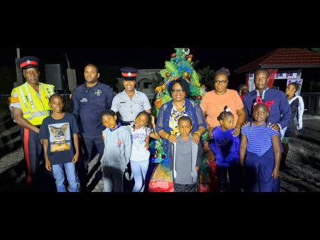 From left: Sergeants Michael Malcolm and Andrew Comrie; Woman Constable Natalee Troupe; Mona Sue Ho, senior manager at the Jamaica Social Investment Fund; Donna Wedderburn, president of the Salt Spring Community Development Committee; and Gregory Harris, a