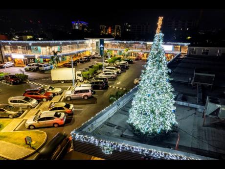 A Christmas tree sits atop Village Plaza on Constant Spring Road in Half-Way Tree, St Andrew.