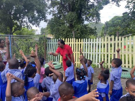 Sabrina Davis engages students at Bethel Basic School in Bull Bay, St Andrew. Grace and Staff donated a new stove to the institution as part of their GK100 early childhood schools project.