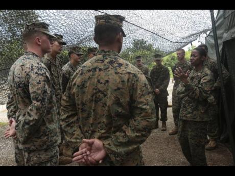 Brig Gen Lorna Mahlock speaks with Marines in this undated photo. She is on her way to becoming a major general in the US Marine Corps.