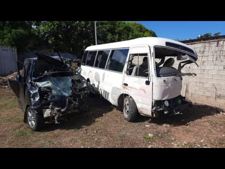 The ill-fated Toyota Coaster bus (right) in which Sydia Jarrett and other passengers were travelling when it collided with the black Toyota Noah minivan (also pictured).