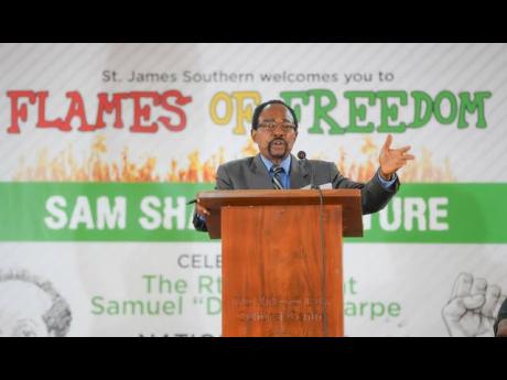 Historiographer and former Mayor of Montego Bay, Shalman Scott, speaks at the inaugural Flames of Freedom Lecture at the Montego Bay Cultural Centre on December 22.
