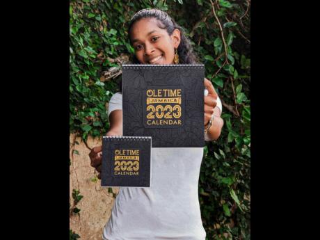 A happy Samantha Hay presents her very own Ole Time Jamaica 2023 calendar.