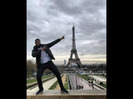 The world traveller puts his Jamaican stamp on the Eiffel Tower in Paris, France.
